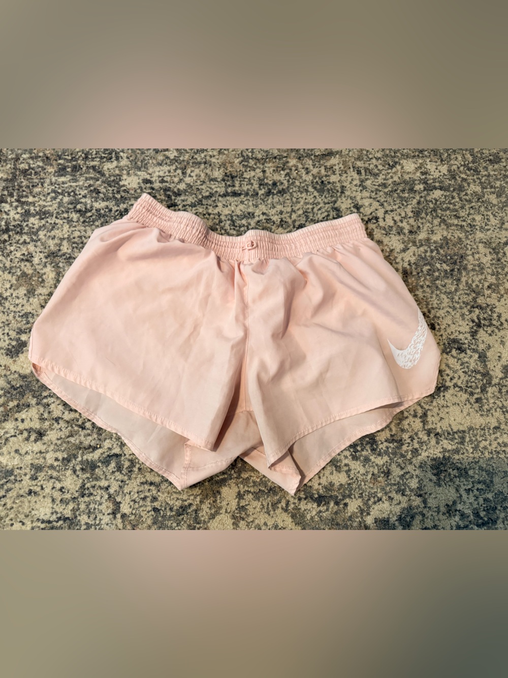 Nike Women's Pale Pink Athletic Shorts with White Swoosh